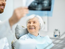 woman smiling while talking to dentist 